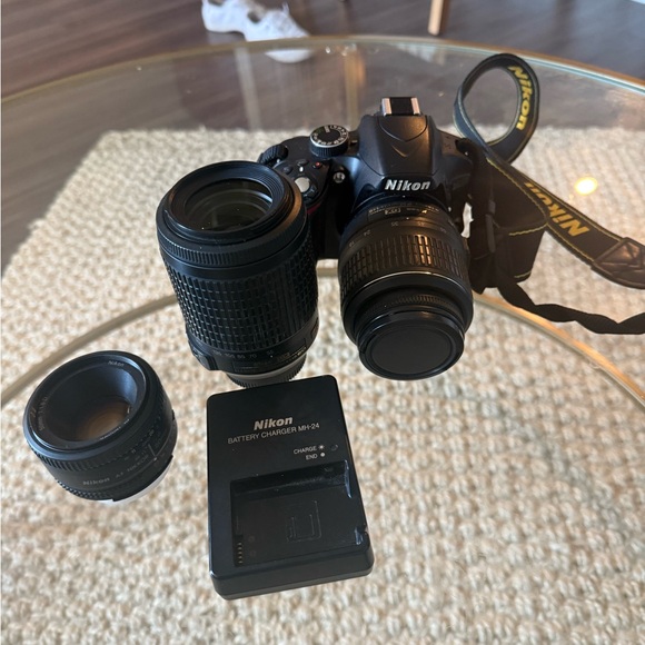 Nikon Black DSLR Camera with multiple lenses